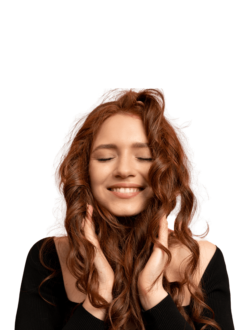 beautiful-red-head-woman-with-close-eyes-posing-over-pink-wall-wavy-hairs-perfect-smile