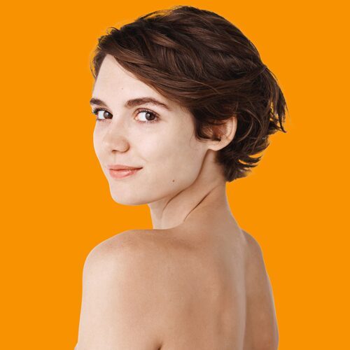 skincare-rear-view-of-young-caucasian-woman-turn-head-back-standing-half-naked-on-white-wall-and-smiling-tender-girl-with-no-makeup-and-natural-beauty skincare-rear-view-of-young-caucasian-woman-turn-head-back-standing-half-naked-on-white-wall-and-smiling-tender-girl-with-no-makeup-and-natural-beauty